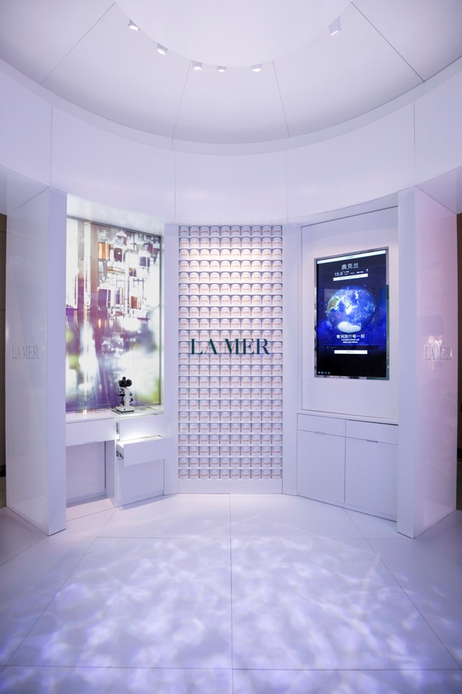 ”Million Dollar Wall” stacked high with Creme de la Mer jars jpg